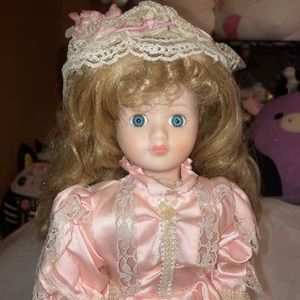 Porcelain Doll with pink dress and dirty blonde hair